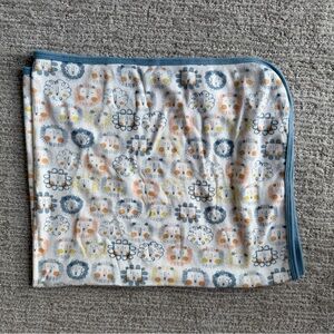 Magnetic Me Lion Print receiving blanket with Blue Trim